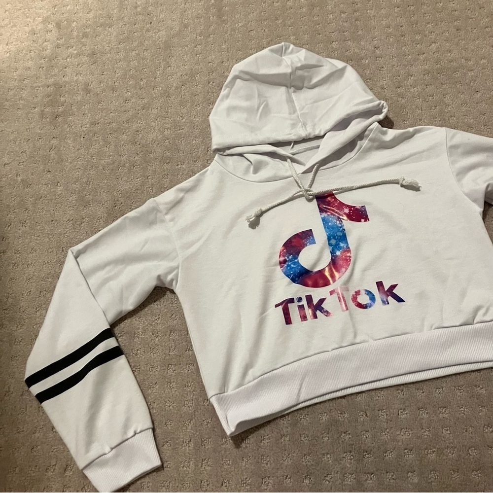 TikTok white long sleeve logo hoodie. Black stripes on arm.